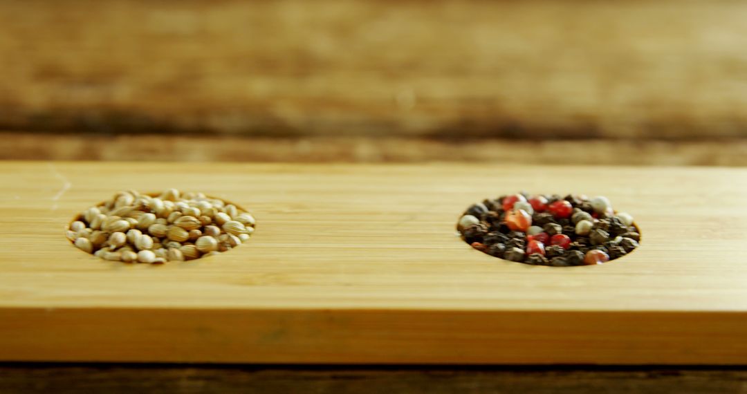 Close-Up of Mixed Peppercorns and Coriander Seeds on Wooden Board - Free Images, Stock Photos and Pictures on Pikwizard.com