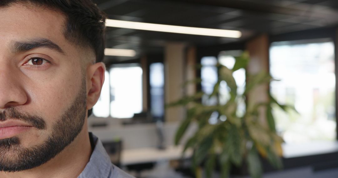 Focused Indian Man Working in Modern Office Environment
