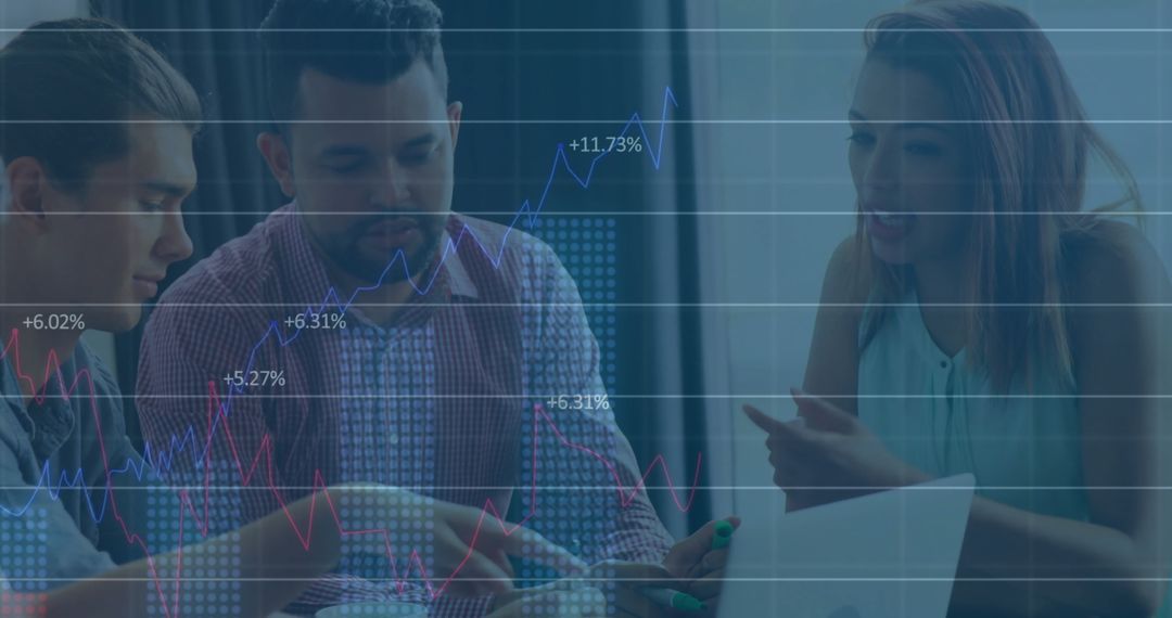 Colleagues Collaborating with Financial Data Overlay in Modern Office