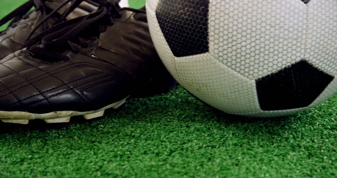 Close-Up of Soccer Ball and Cleats on Green Field Turf - Free Images, Stock Photos and Pictures on Pikwizard.com