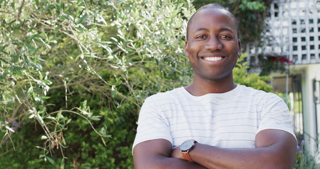 Confident Man Smiling Outdoors Arms Crossed Copy Space