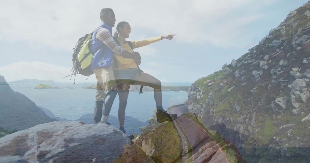 Couple Enjoying Scenic View on Sea Cliff Adventure