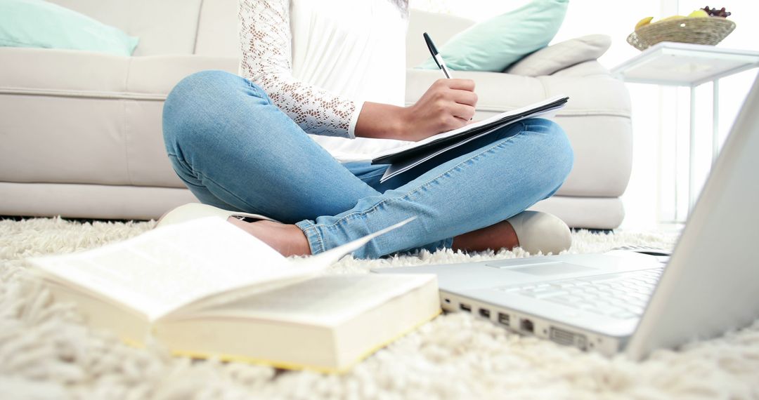 Young Woman Studying with Laptop and Books in Cozy Home Environment - Free Images, Stock Photos and Pictures on Pikwizard.com