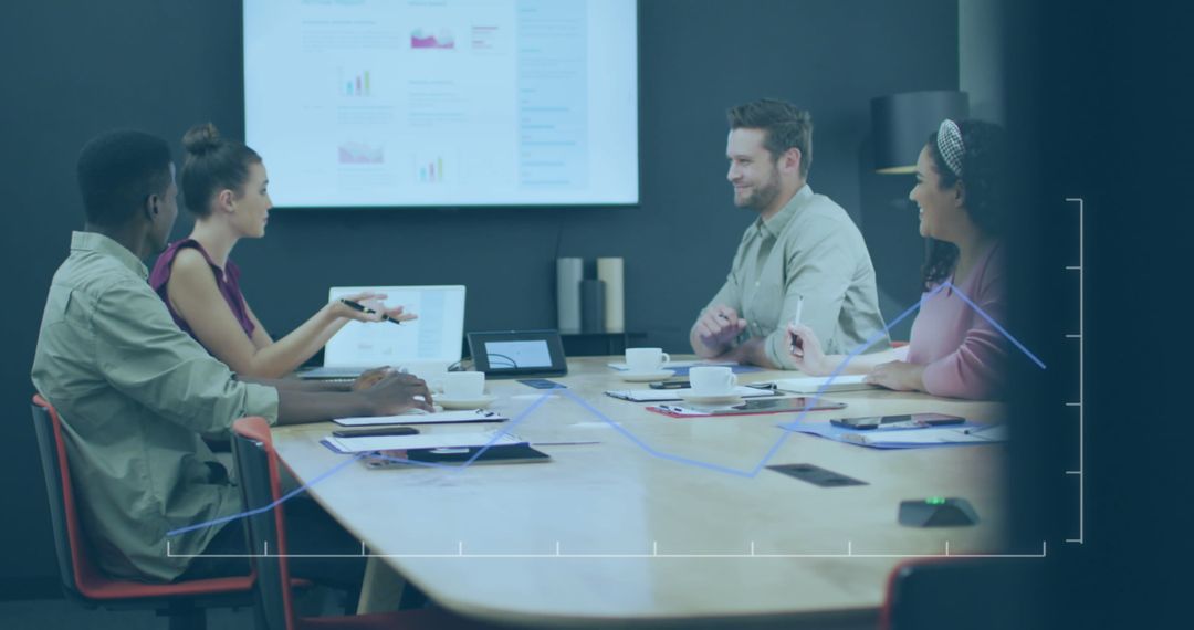 Diverse Business Team Discussing Strategy Around Conference Table