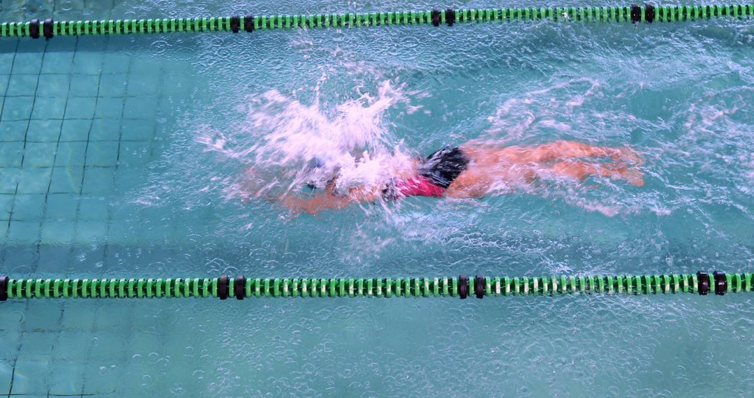 Swimmer Practicing Freestyle Stroke in Olympic Pool - Free Images, Stock Photos and Pictures on Pikwizard.com