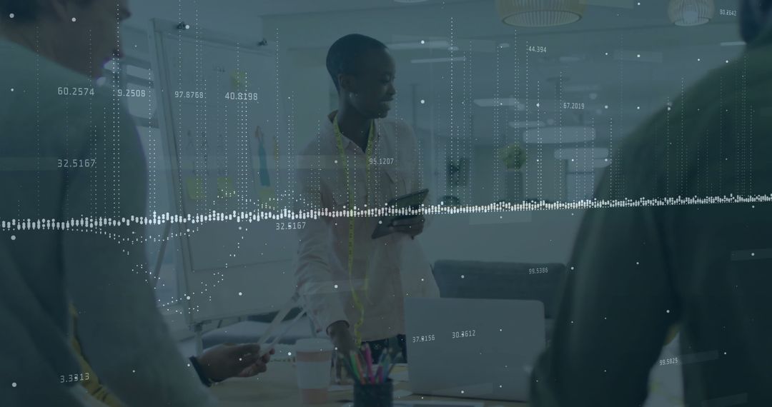 Data Analysis Meeting with Diverse Colleagues in Modern Office