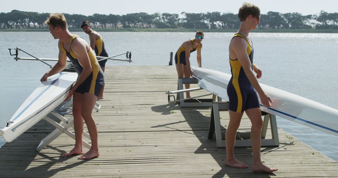 Rowing Team Preparing Boats on Dock for Training Session - Free Images, Stock Photos and Pictures on Pikwizard.com