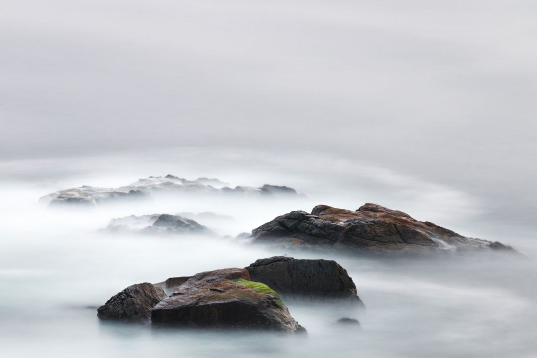 Misty Sea with Rocks in Tranquil Ocean Scene - Free Images, Stock Photos and Pictures on Pikwizard.com