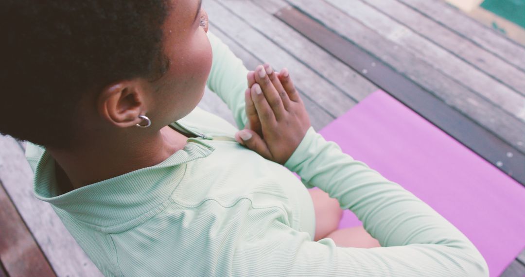 African American woman practicing yoga outdoors on wooden deck - Free Images, Stock Photos and Pictures on Pikwizard.com