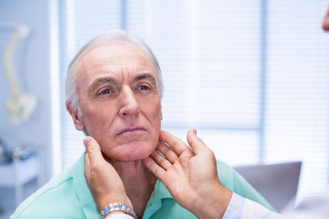 Doctor examining senior patients neck - Free Images, Stock Photos and Pictures on Pikwizard.com