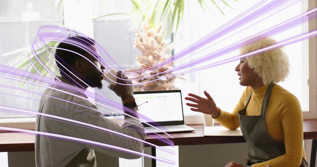 Barista and Customer Engaged in Conversation at Coffee Shop Counter