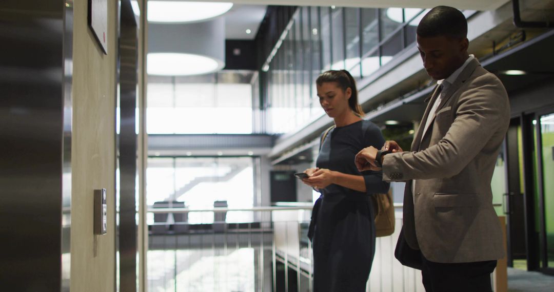 Professional Team Executives by Office Elevator Checking Devices