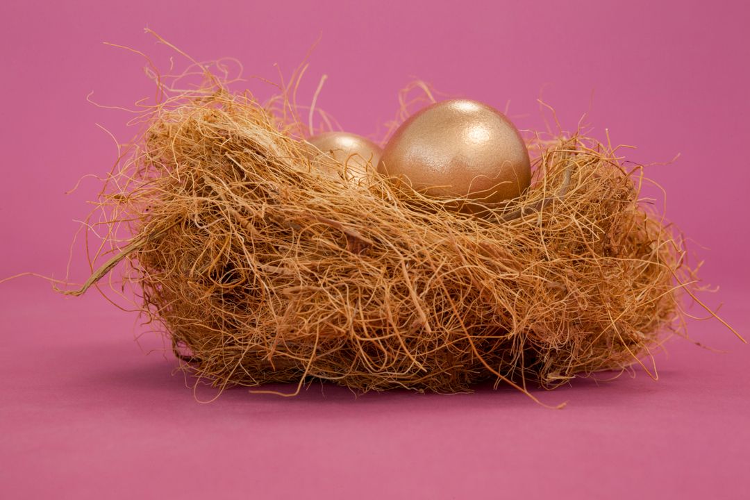 Golden Eggs in Nest on Pink Background for Easter - Free Images, Stock Photos and Pictures on Pikwizard.com