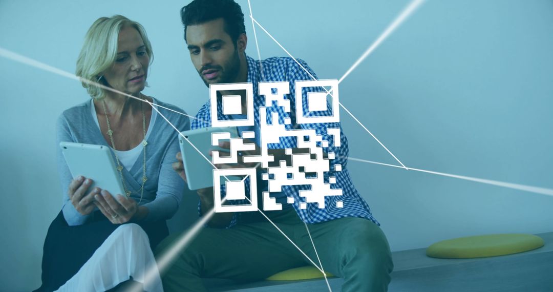 Coworkers Interacting with Digital QR Code Technology in Modern Office