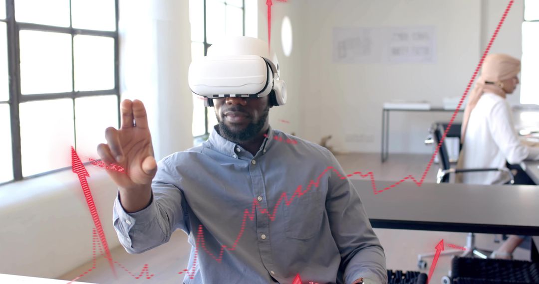 Man Engaging with Augmented Analytics Using VR Headset in Modern Office