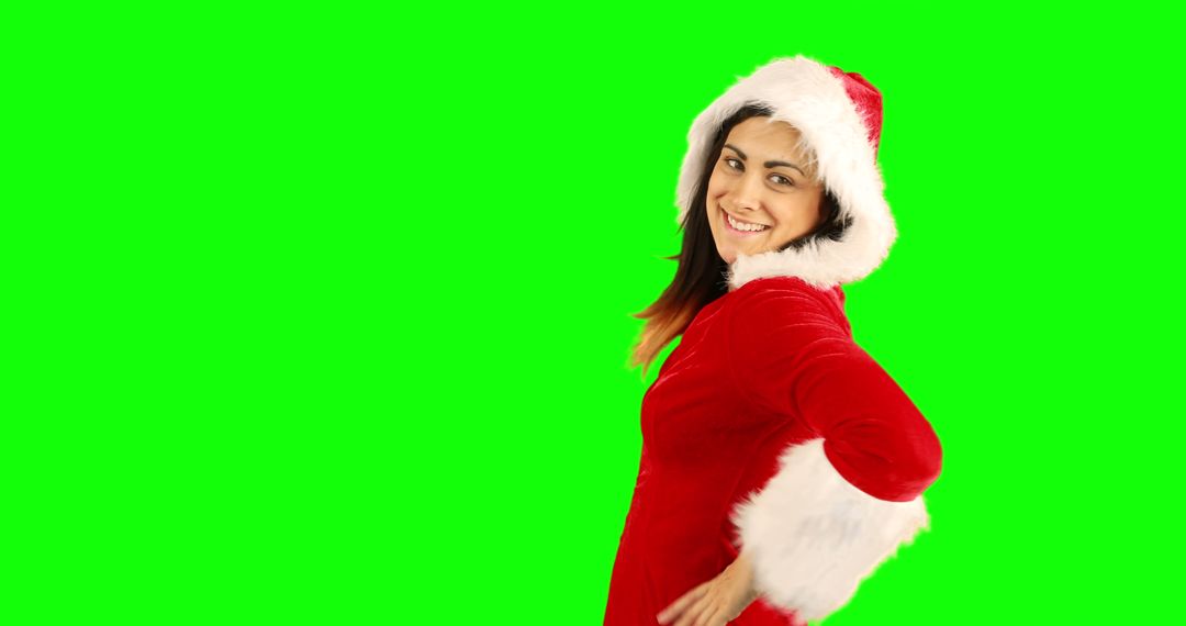 Smiling Woman in Santa Claus Outfit on Green Background - Free Images, Stock Photos and Pictures on Pikwizard.com