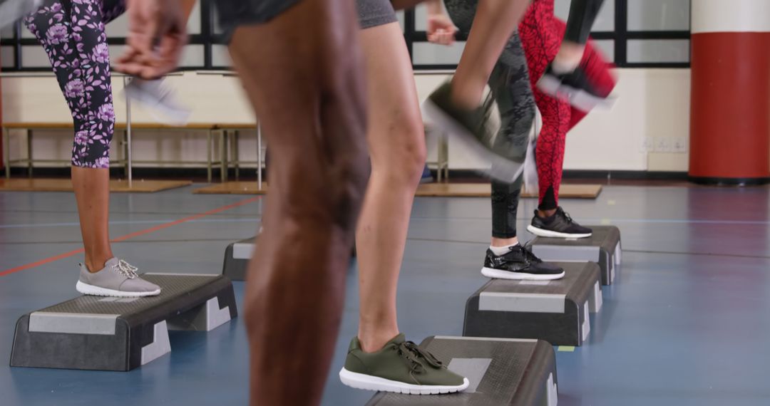 Diverse Group Participating in Energetic Step Aerobics Class