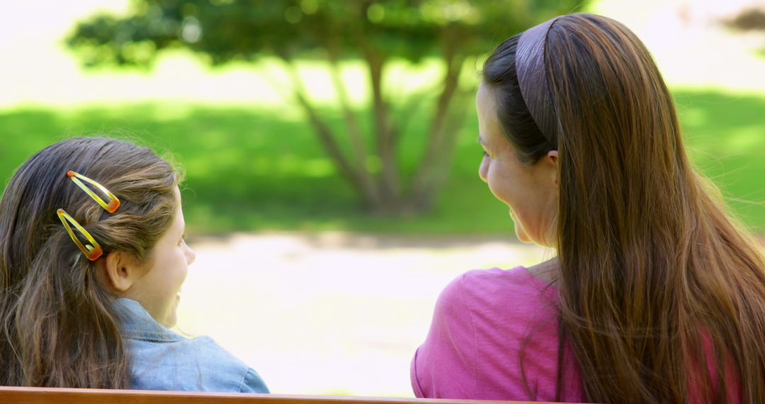 Mother and Daughter Smiling on a Park Bench - Free Images, Stock Photos and Pictures on Pikwizard.com