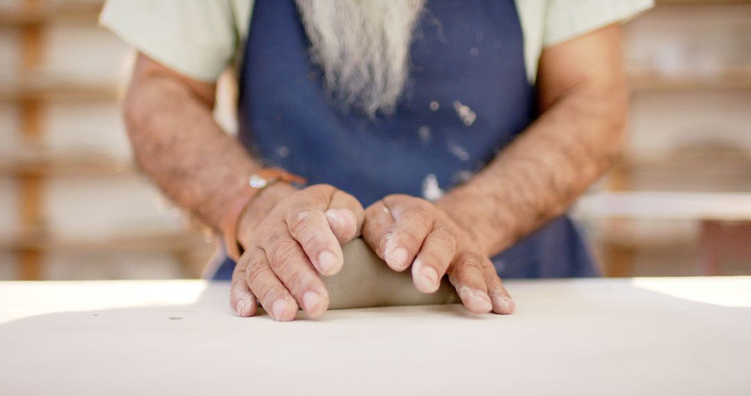 Close-up of Potter Shaping Clay on Table - Free Images, Stock Photos and Pictures on Pikwizard.com