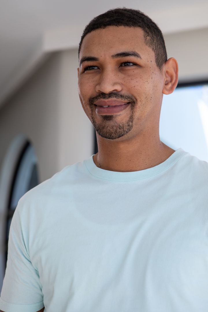 Man in Modern Space Smiling with Minimalistic Backdrop