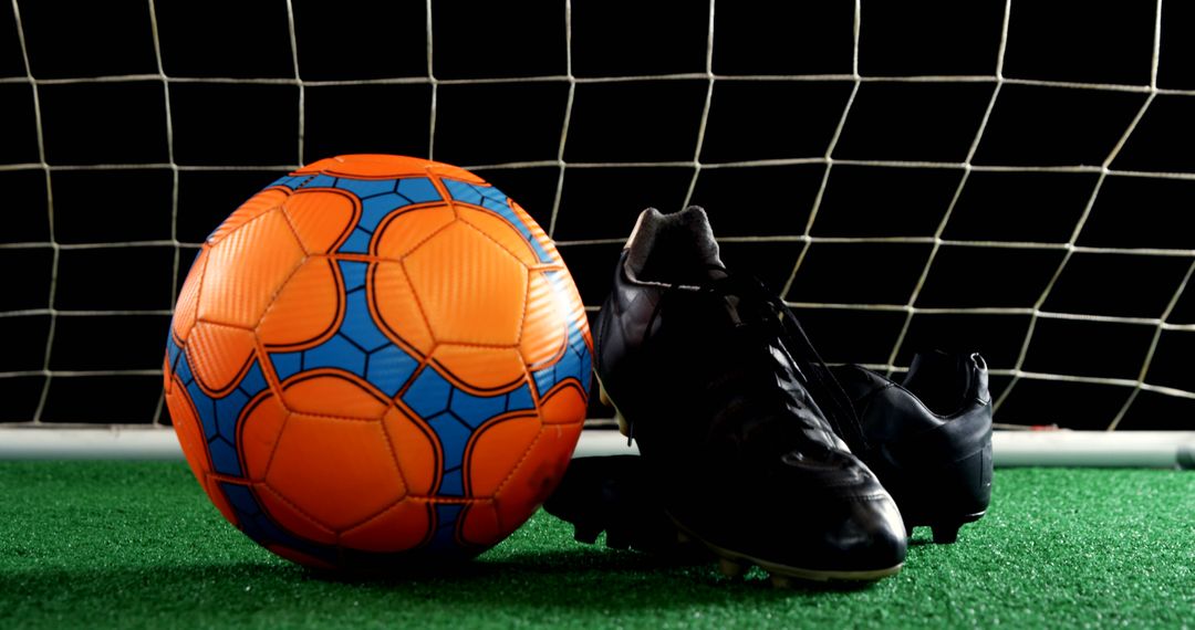 Close-up of Soccer Ball and Cleats on Field - Free Images, Stock Photos and Pictures on Pikwizard.com