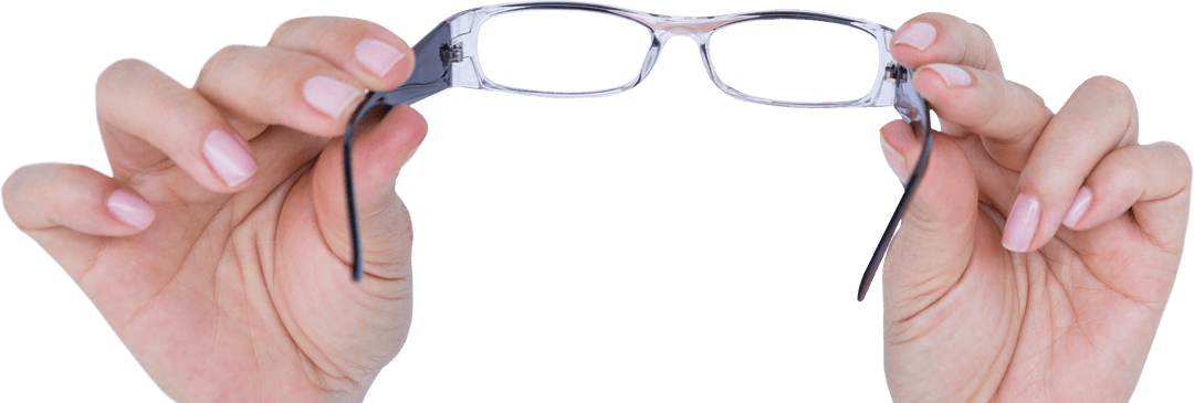 Hands Holding Eyeglasses Isolated on Transparent Surface