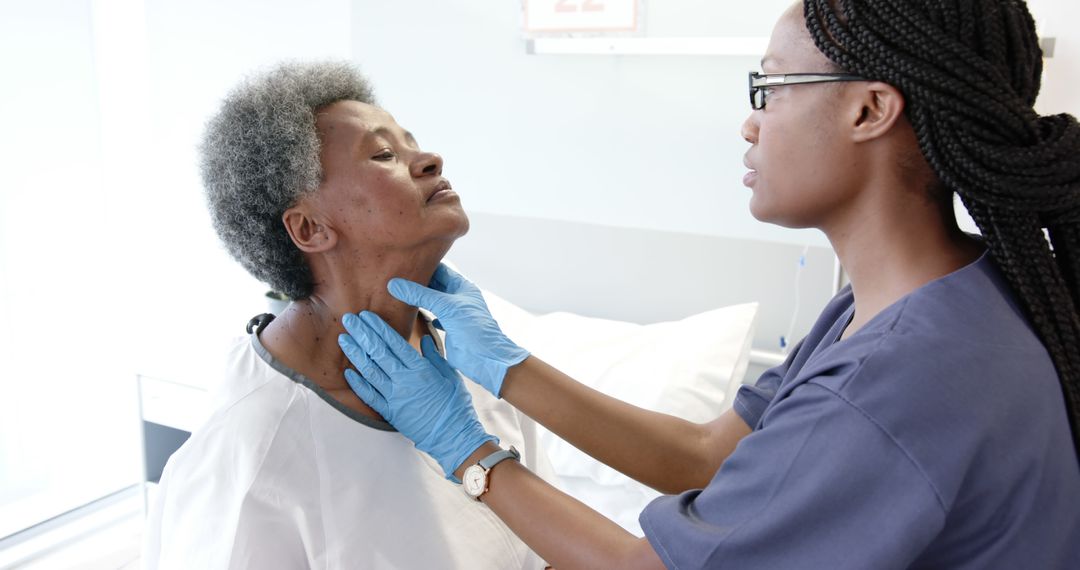 Healthcare Worker Examining Senior Patient in Hospital Room - Free Images, Stock Photos and Pictures on Pikwizard.com