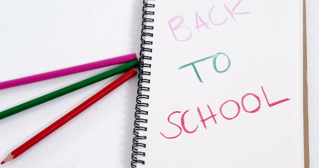 Colorful Back to School Concept with Pencils and Notebook