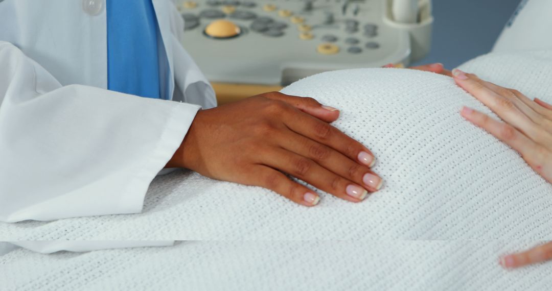 Doctor Holding Patient's Pregnant Belly During Ultrasound Exam - Free Images, Stock Photos and Pictures on Pikwizard.com