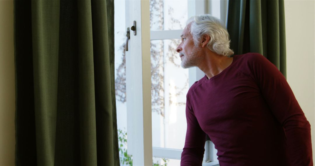 Elderly Man Looking Out Window with Hope at Home - Free Images, Stock Photos and Pictures on Pikwizard.com