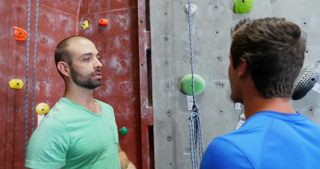 Instructor Giving Climbing Lessons at Indoor Rock Gym - Free Images, Stock Photos and Pictures on Pikwizard.com