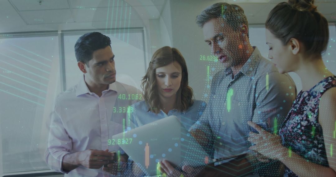 Diverse Business Team Analyzing Digital Data Within Modern Office