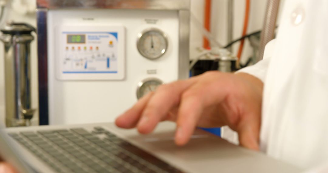 Scientist Using Laptop for Data Entry in Laboratory - Free Images, Stock Photos and Pictures on Pikwizard.com