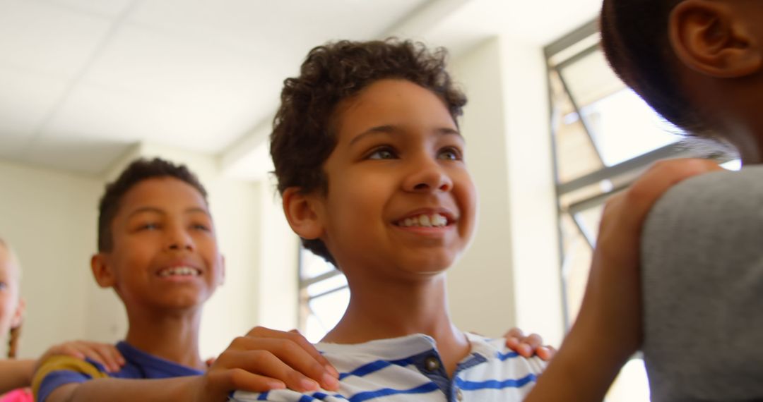 Happy Children Standing in Line in Classroom