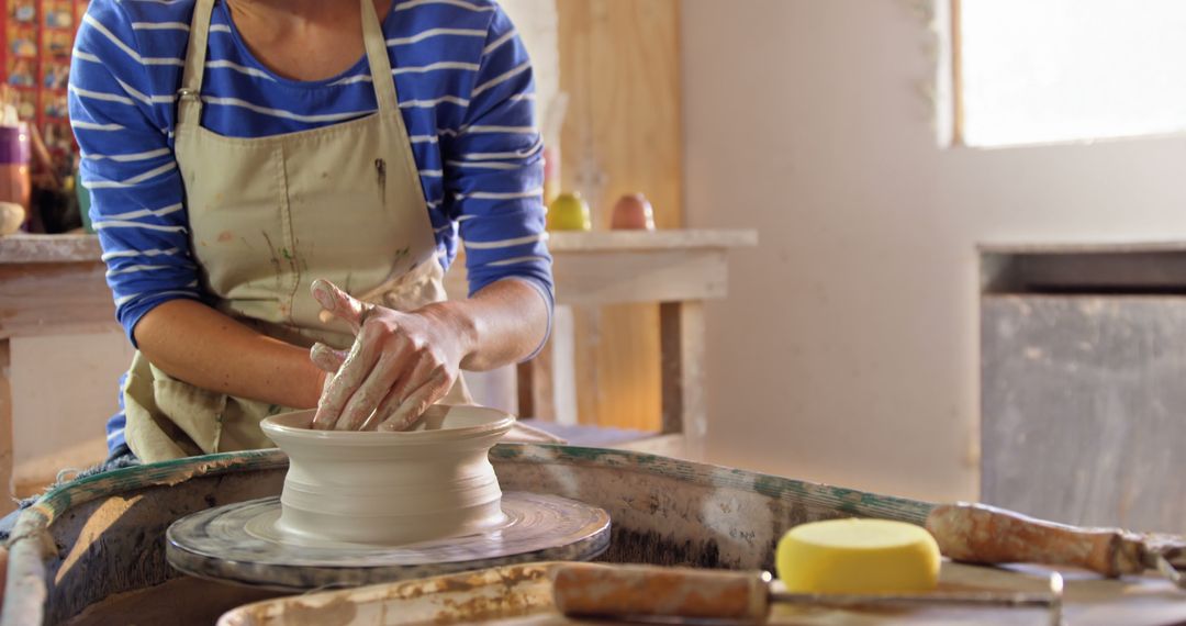 Hands Shaping Clay on Pottery Wheel - Free Images, Stock Photos and Pictures on Pikwizard.com