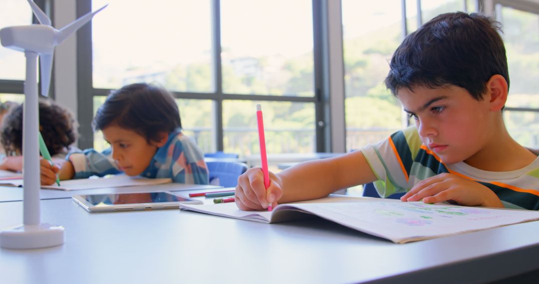 Diverse Children Studying Wind Energy Concepts in Classroom