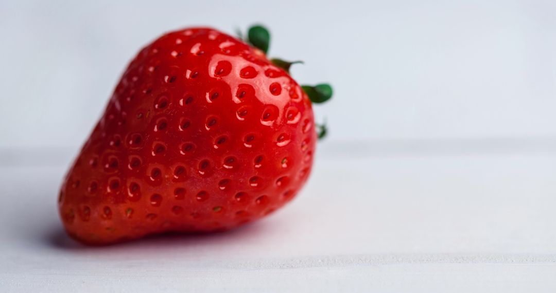 Fresh Red Strawberry on White Surface