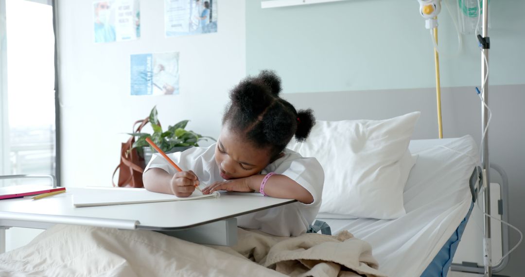 Young Girl Coloring in Hospital Bed - Free Images, Stock Photos and Pictures on Pikwizard.com