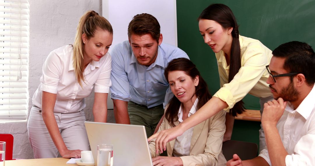 Team Collaboration in Office with Laptop