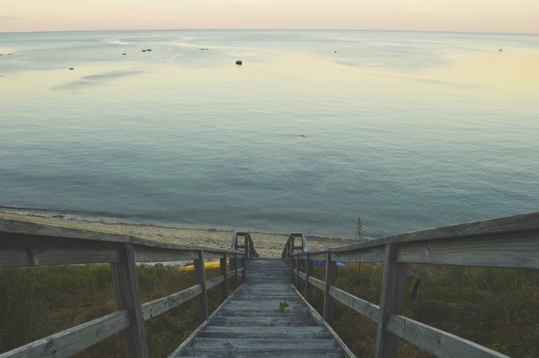 Wooden Steps Leading to Serene Beach at Sunset - Free Images, Stock Photos and Pictures on Pikwizard.com