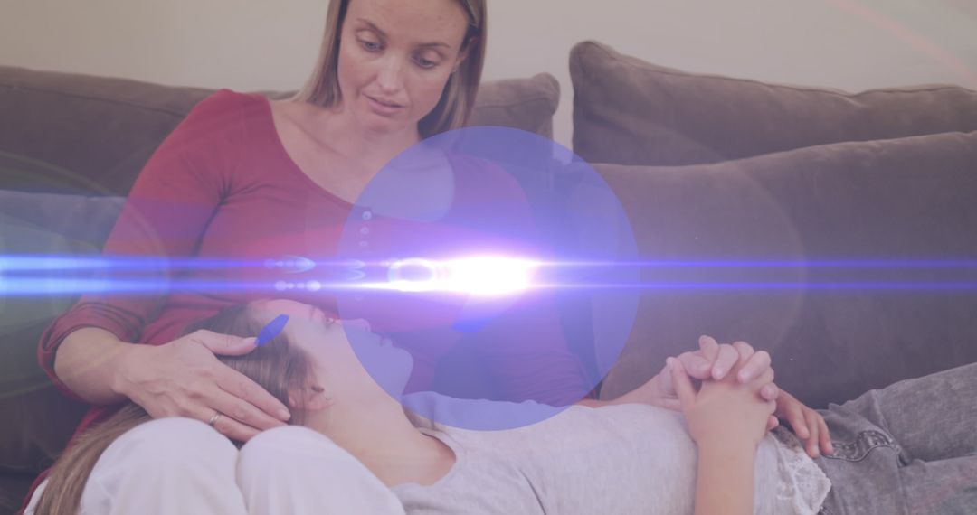 Mother Comforting Daughter on Sofa with Digital Overlay