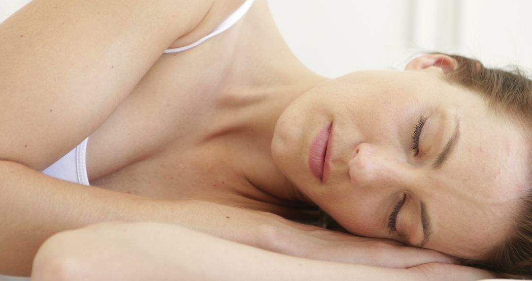 Peaceful Woman Sleeping on Pillow with Closed Eyes in Bed - Free Images, Stock Photos and Pictures on Pikwizard.com