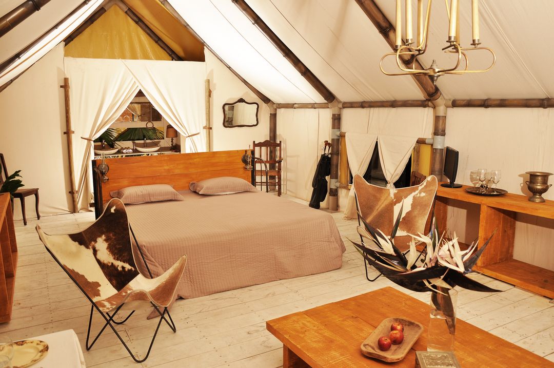 Luxurious Glamping Tent Interior with Cozy Bed and Rustic Décor - Free Images, Stock Photos and Pictures on Pikwizard.com