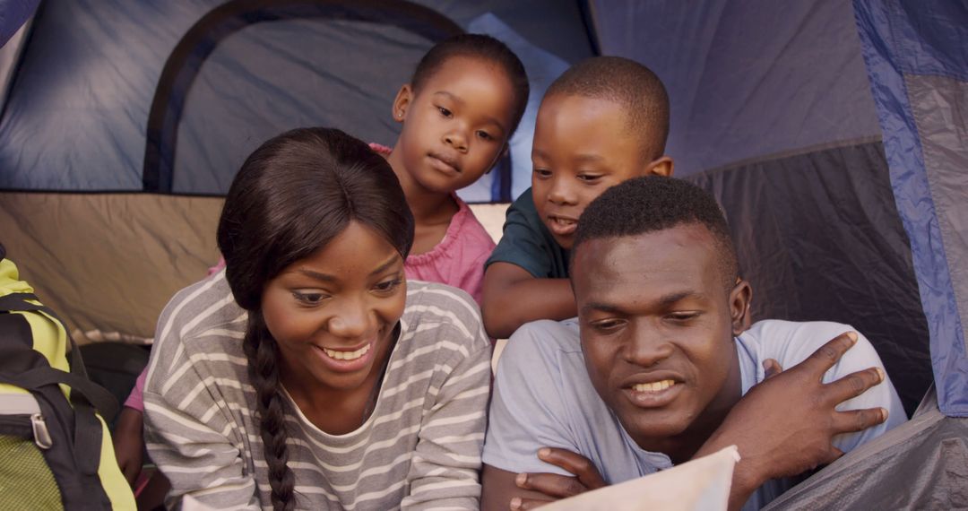 Happy African American Family Camping Inside Tent - Free Images, Stock Photos and Pictures on Pikwizard.com