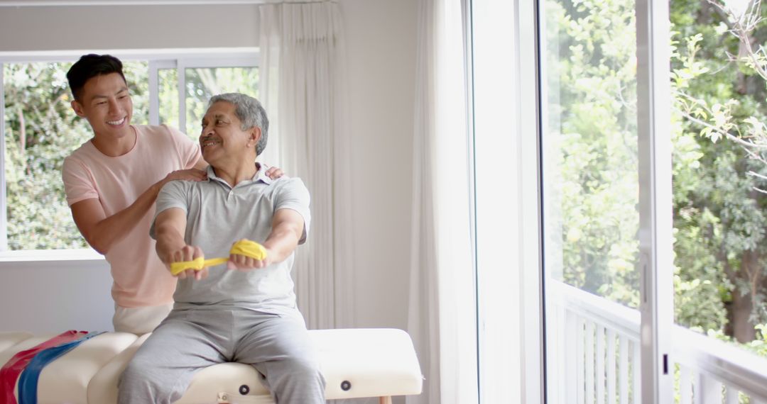 Senior Rehabilitation Session with Physiotherapist Using Exercise Band