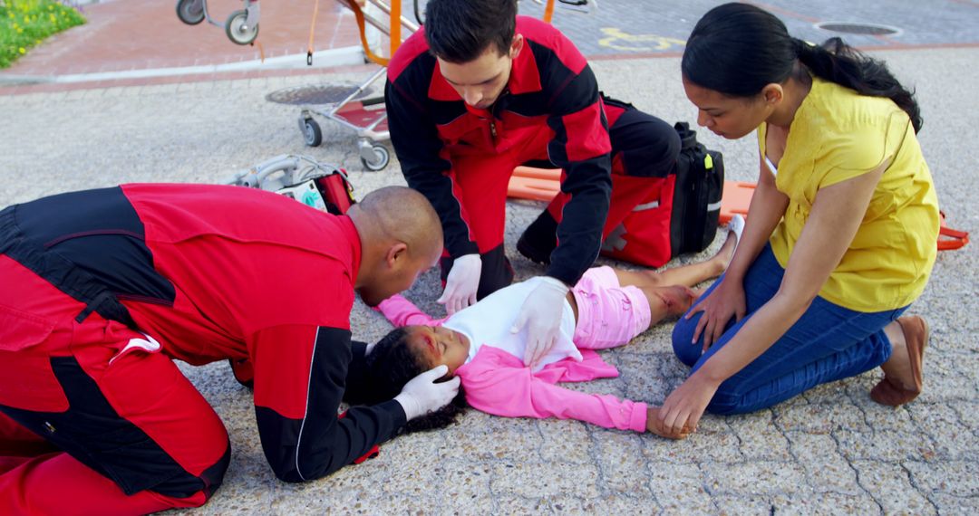 Paramedics Assisting Unconscious Child Lying on Street - Free Images, Stock Photos and Pictures on Pikwizard.com