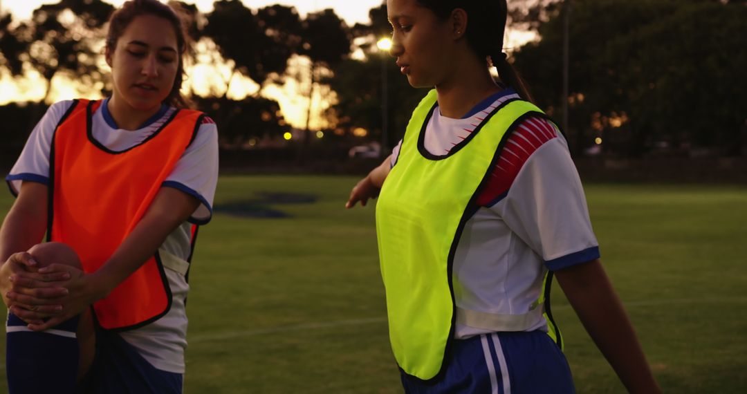 Female Soccer Players Warming Up Before Evening Practice - Free Images, Stock Photos and Pictures on Pikwizard.com