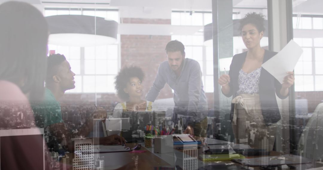 Diverse Team Collaborating in Modern Office with Double Exposure Effect