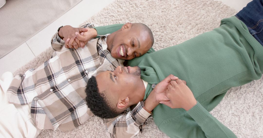 Loving Couple Embracing on Carpet at Home
