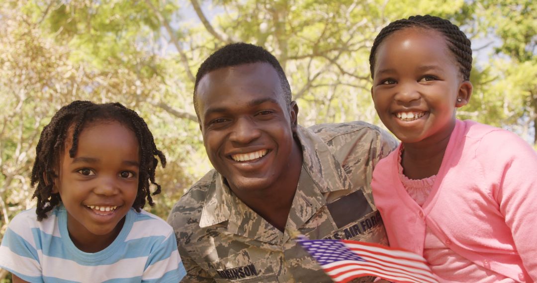 Smiling African American Military Father with Two Happy Daughters Outdoors - Free Images, Stock Photos and Pictures on Pikwizard.com